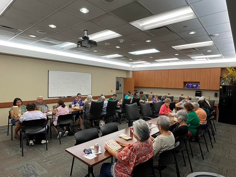 Picture of a group of people sitting down at tables in a conference room class at Jackson County Hospital District.