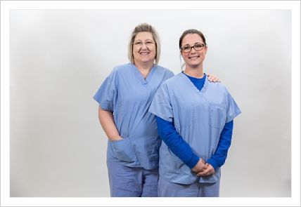 Picture of two smiling female Nurses.