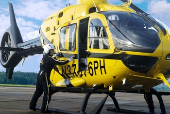 Emergency Air Medical Staff closing a Helicopter door